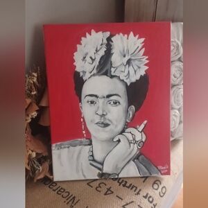 Artist Frida Kahlo Portrait with Red Background